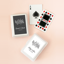 Load image into Gallery viewer, Two deck of cards in plastic cases, each case with a customized label of two lines of text and a floral design. One label shown in black and the other in white.
